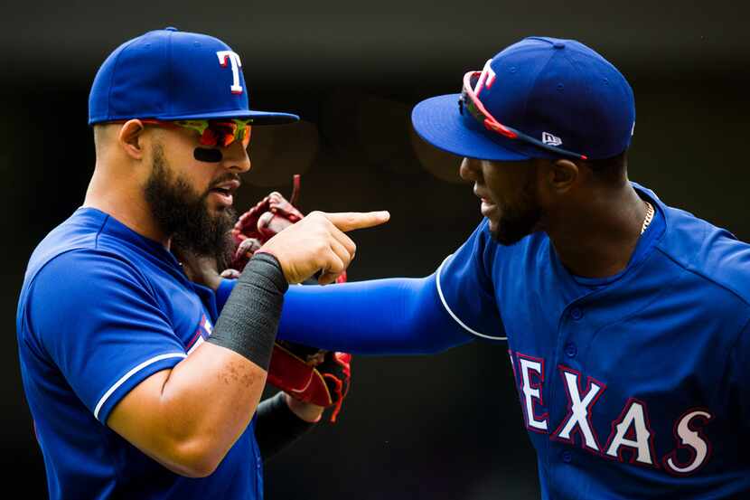 Texas Rangers second baseman Rougned Odor (12) jokes with fellow infielder Jurickson Profar...