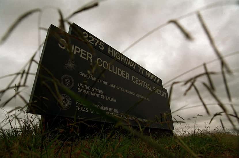 Weeds grew around a sign at the entrance to the abandoned Super Collider project near...