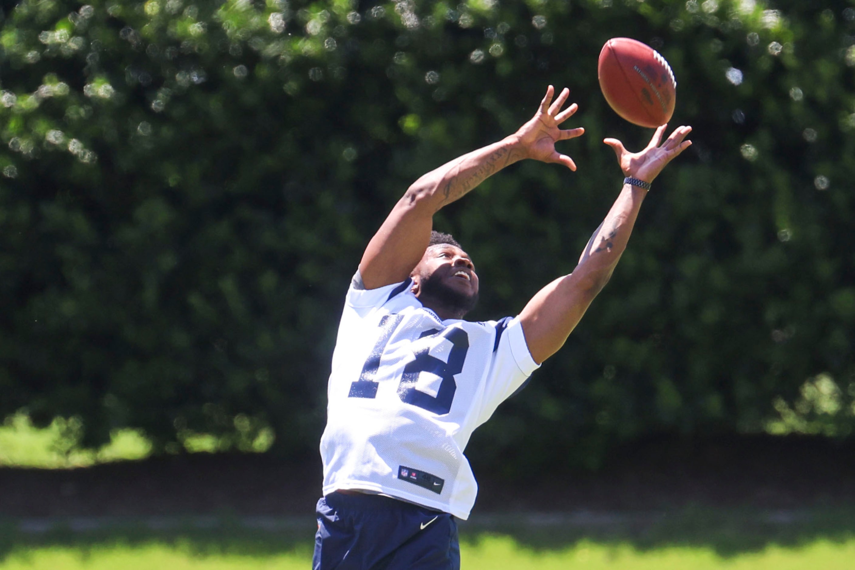 Dallas Cowboys wide receiver Ryan Flournoy receives a throw during a rookie minicamp, on...