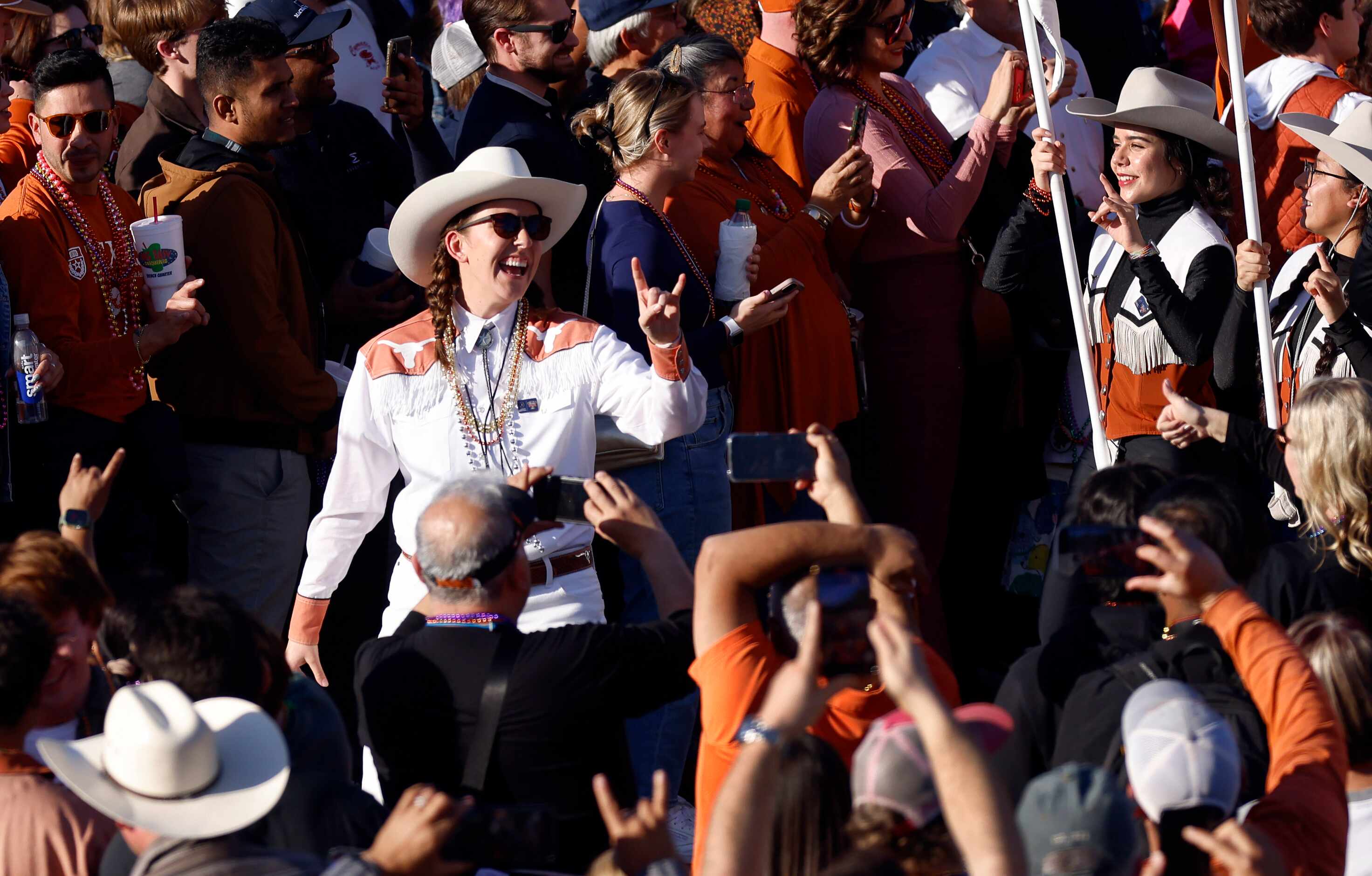 University of Texas Longhorn Band marches into Jackson Square during the Mardi Gras-style...