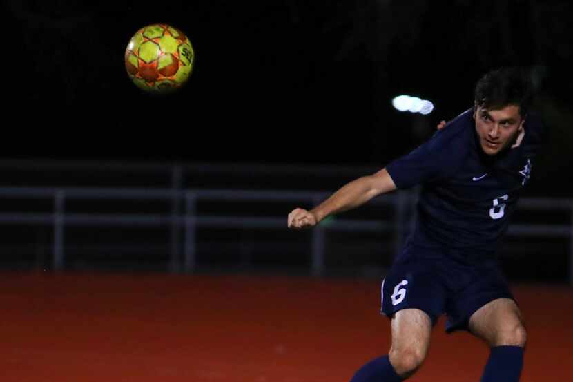 Frisco Lone Star's Alex Gonzalez (No. 6) goes for a header in a soccer match during the 2022...