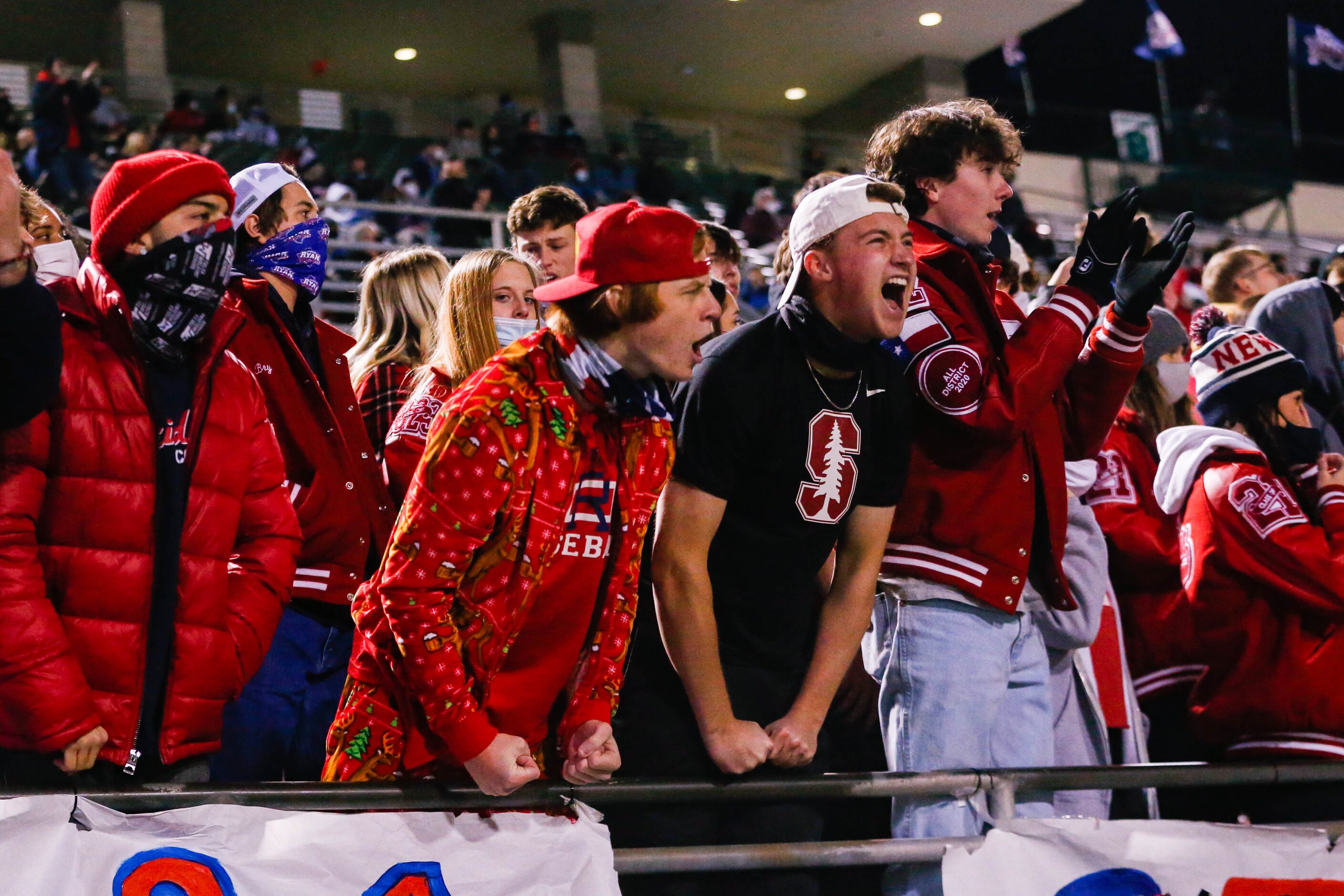 Denton Ryan football fans celebrate a play against Frisco Lone Star during the fourth...