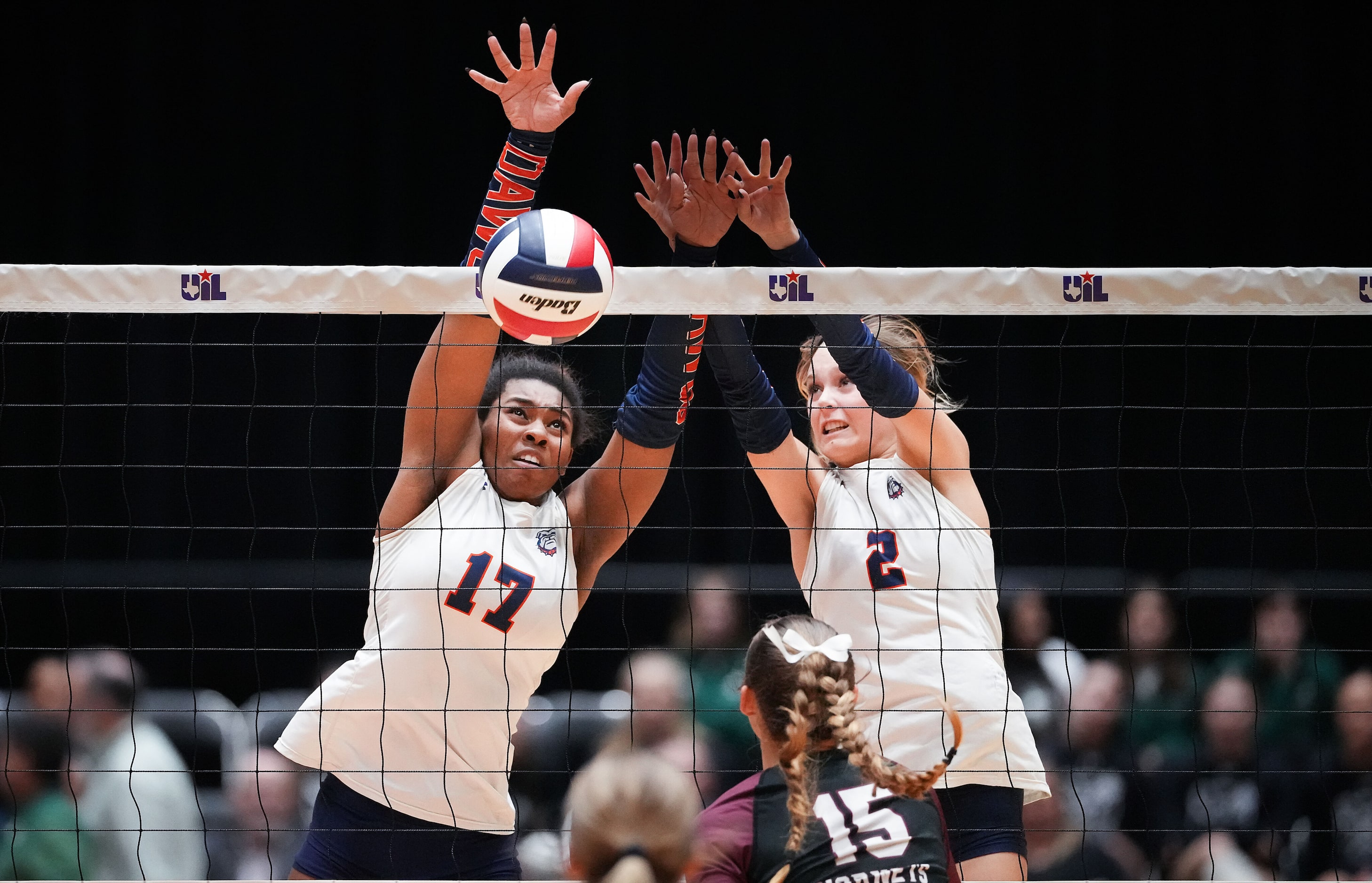 McKinney North's Chloe Lewis (17) and Allyn Brewer (2) go up for a block against Corpus...