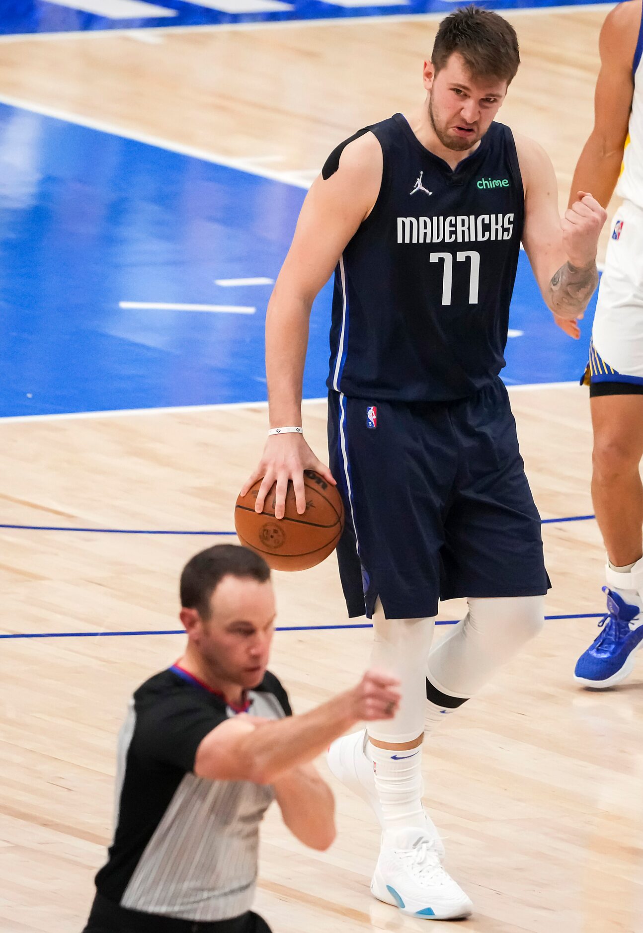 Dallas Mavericks guard Luka Doncic (77) reacts after being called for an offensive foul...