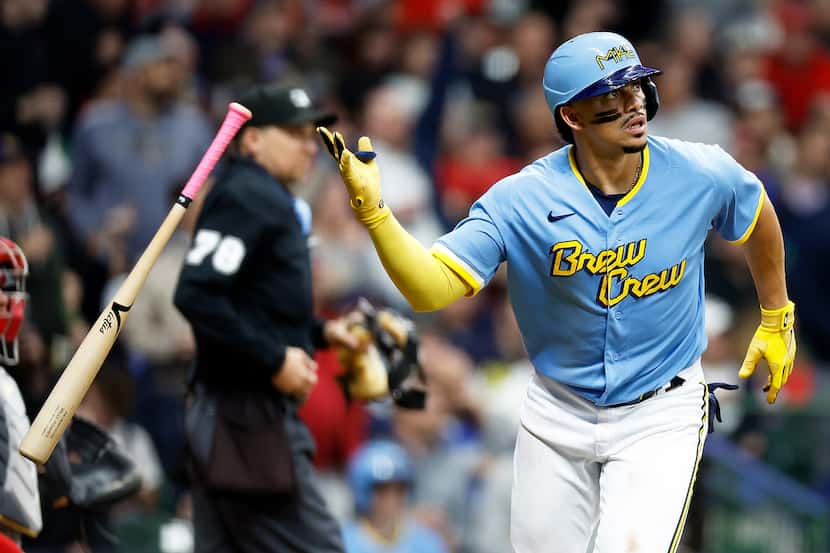 Willy Adames of the Milwaukee Brewers, wearing the team's City Connect uniform, hits a solo...
