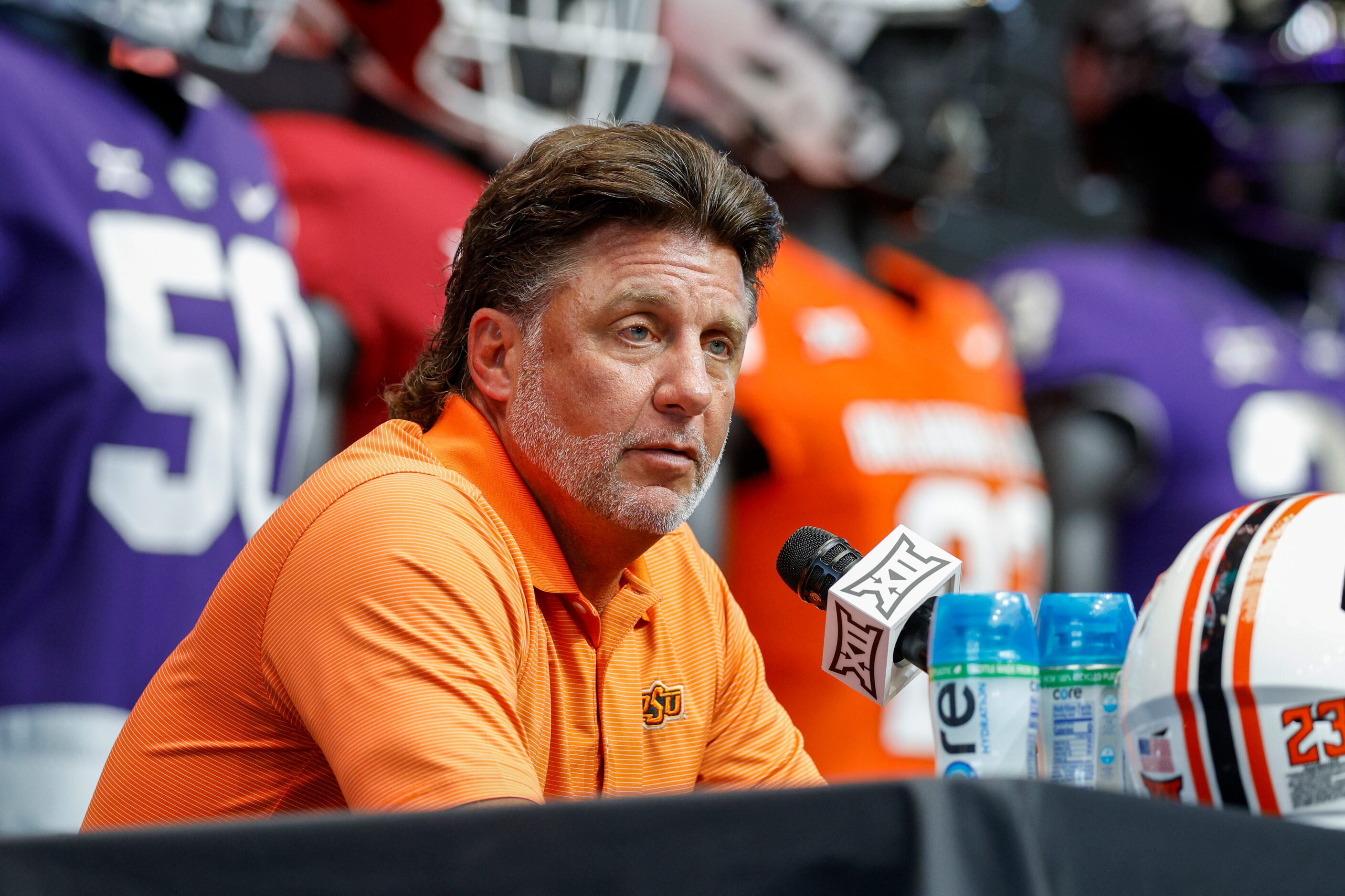 Oklahoma State head coach Mike Gundy speaks during the Big 12 Media Days at AT&T Stadium,...