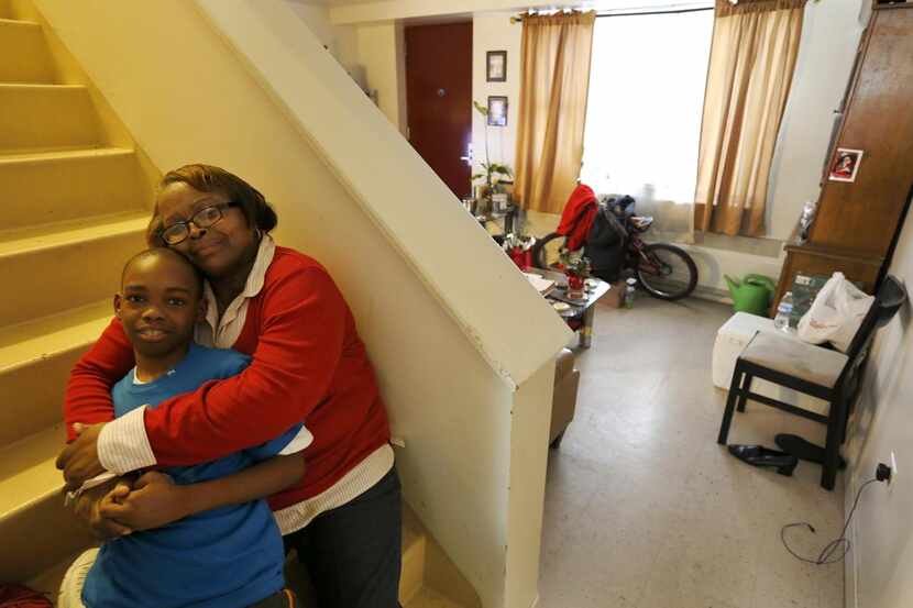 
Debra Aldridge, right, poses with her grandson, Mario Hendricks, at her home in Chicago....