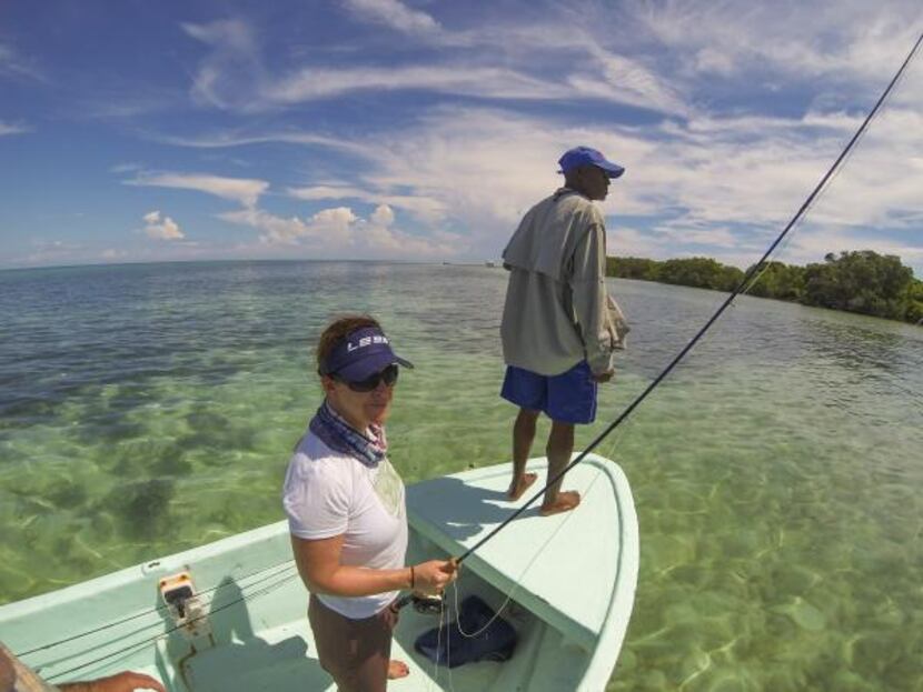 
Lori Irwin and guide Lloyd Nuñez scan for bonefish, which are lightning fast and prized by...