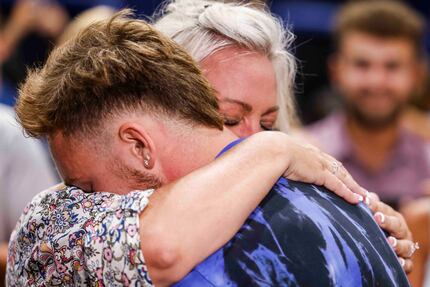 Rockwall-Heath baseball player Jett Williams, hugs his mother April after he was selected...