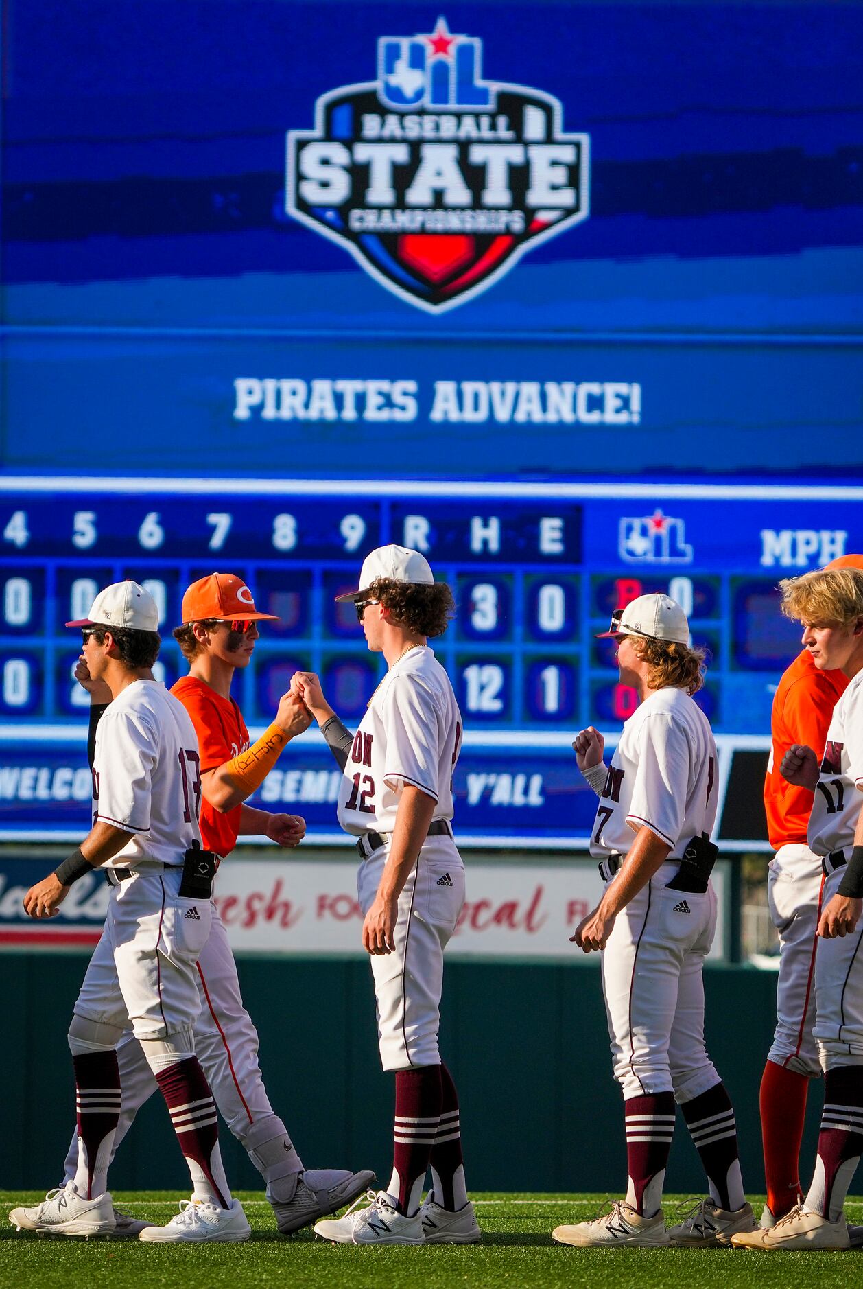 Celina and Sinton players shake hands after Sinton’s victory in a UIL 4A baseball state...