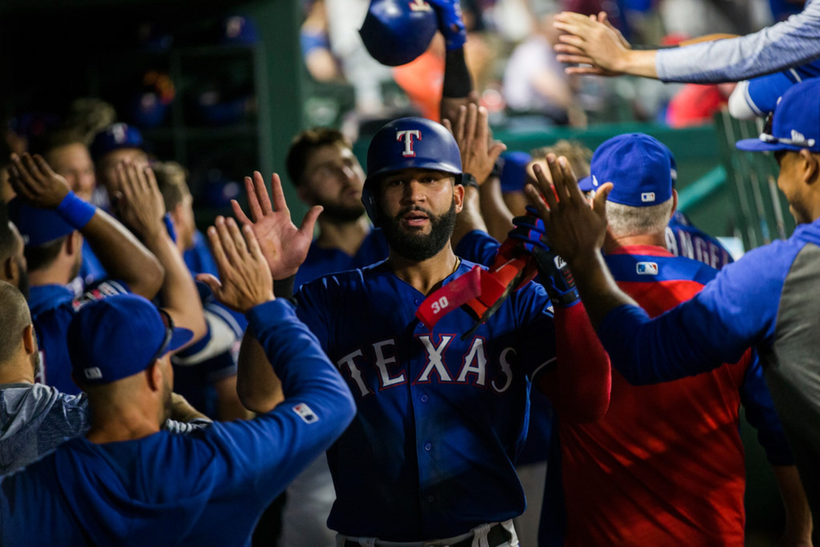 Texas Rangers right fielder Nomar Mazara (30) celebrates a run due to a home run by center...