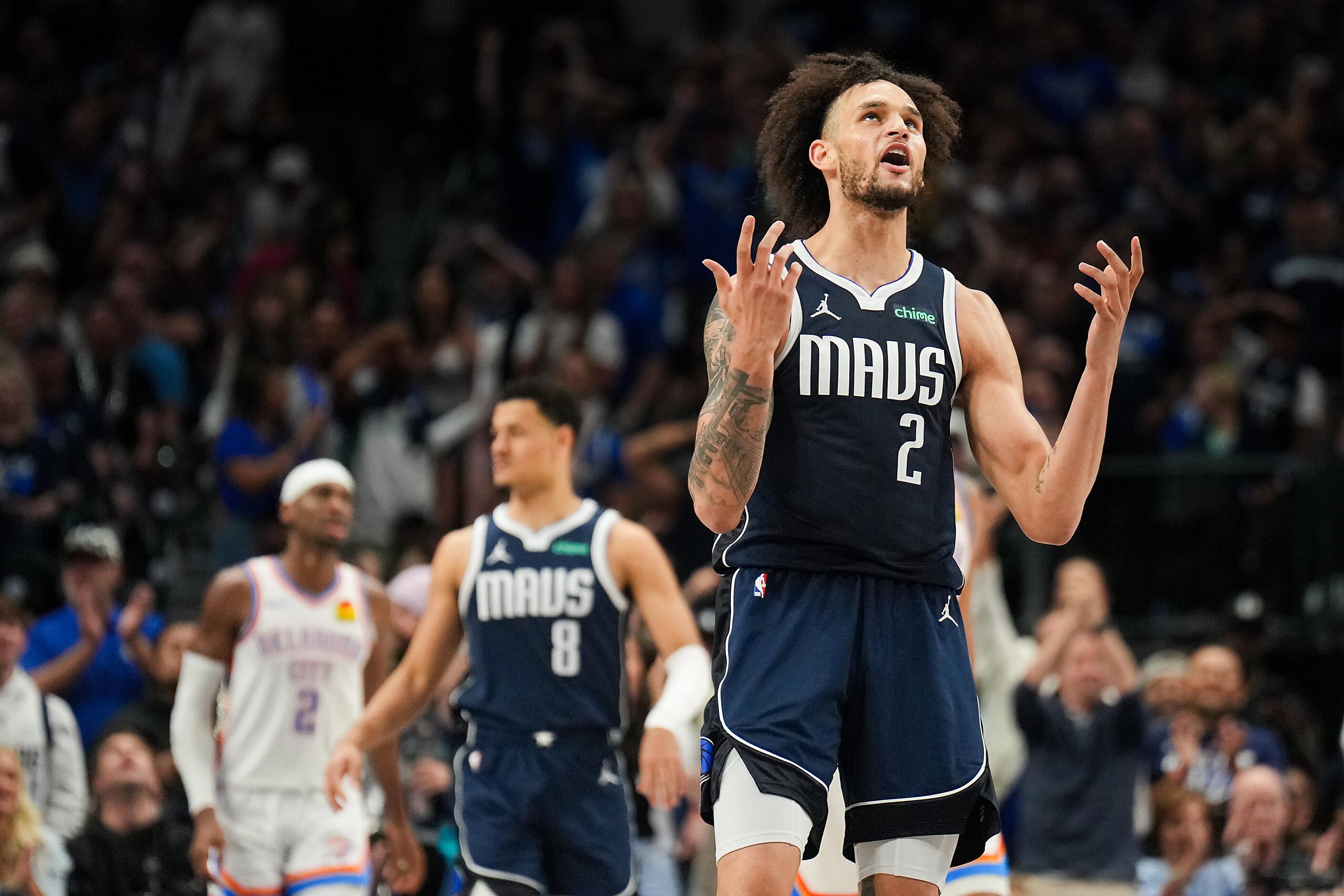 Dallas Mavericks center Dereck Lively II (2) celebrates after a basket during the first half...