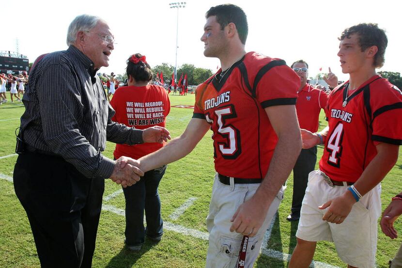 Former Baylor football coach Grant Teaff greets West Trojans football player Tyler...