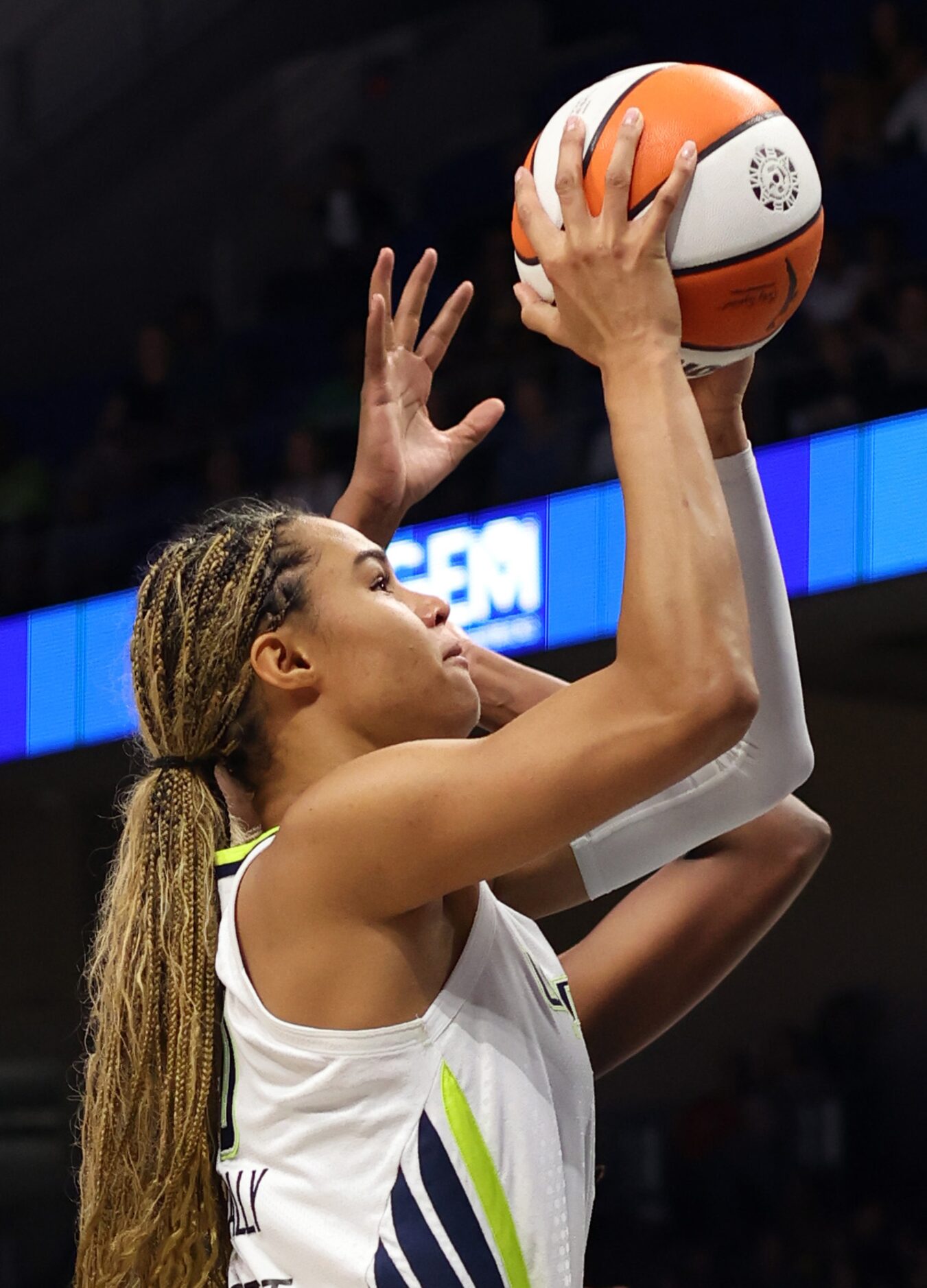 Dallas Wings forward Satou Sabally (0) shoots over the defense of a New York Liberty player...