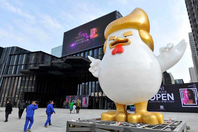 A giant chicken sculpture made in the likeness of Donald Trump was put up outside a shopping...