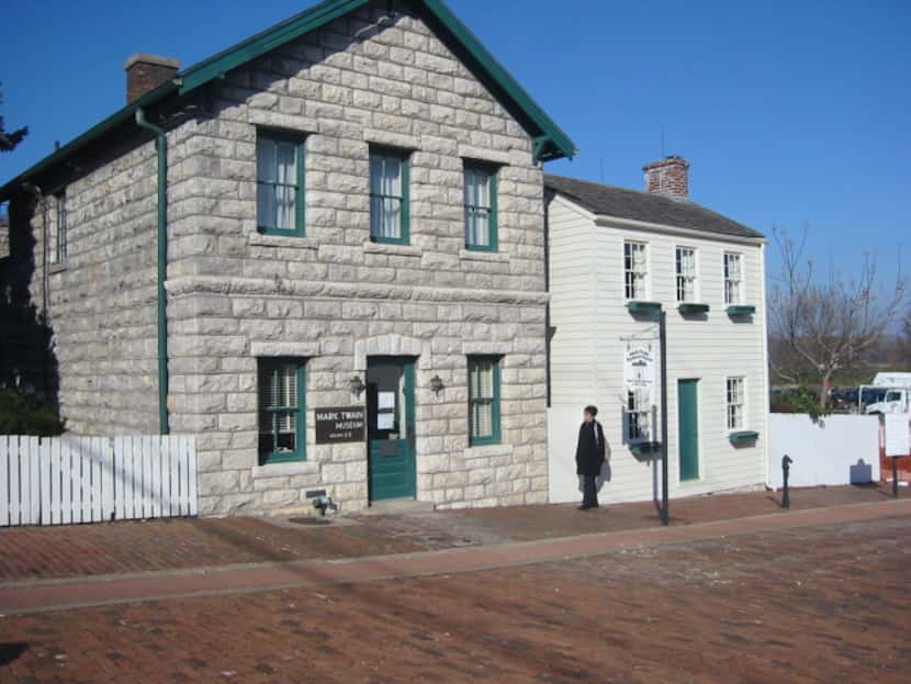 Samuel Clemens' boyhood home, right, is one of eight historic properties in the Mark Twain...