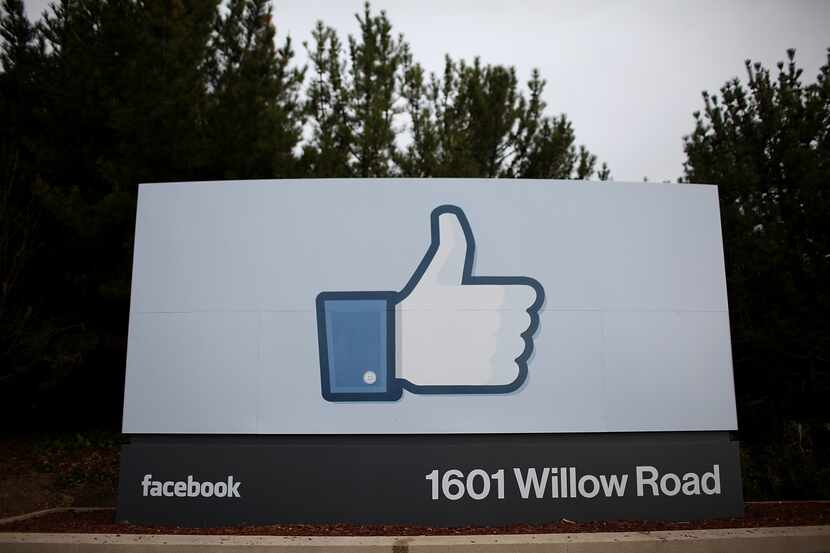 A sign with the "like" symbol stands in front of the Facebook headquarters in Menlo Park,...