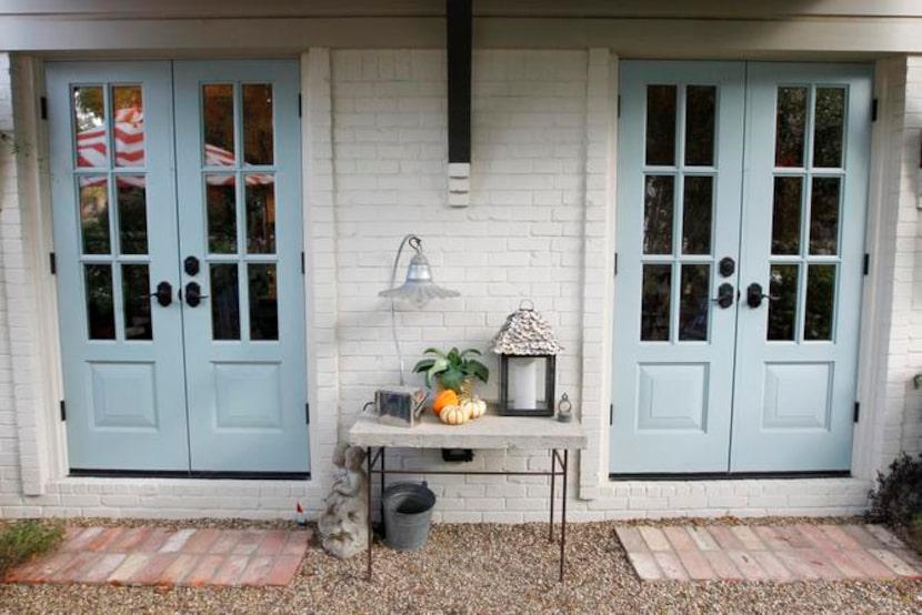 
French doors connect the kitchen to a sunken garden. 
