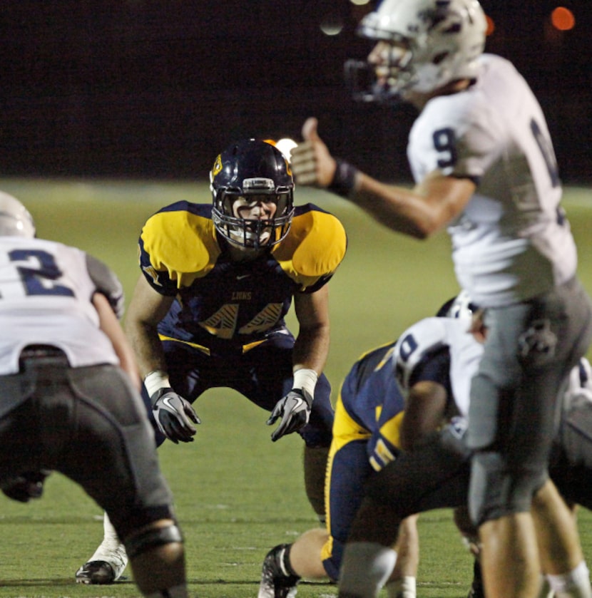 Prestonwood Christian Academy middle linebacker Mike Mitchell (44) eyes Liberty Christian...