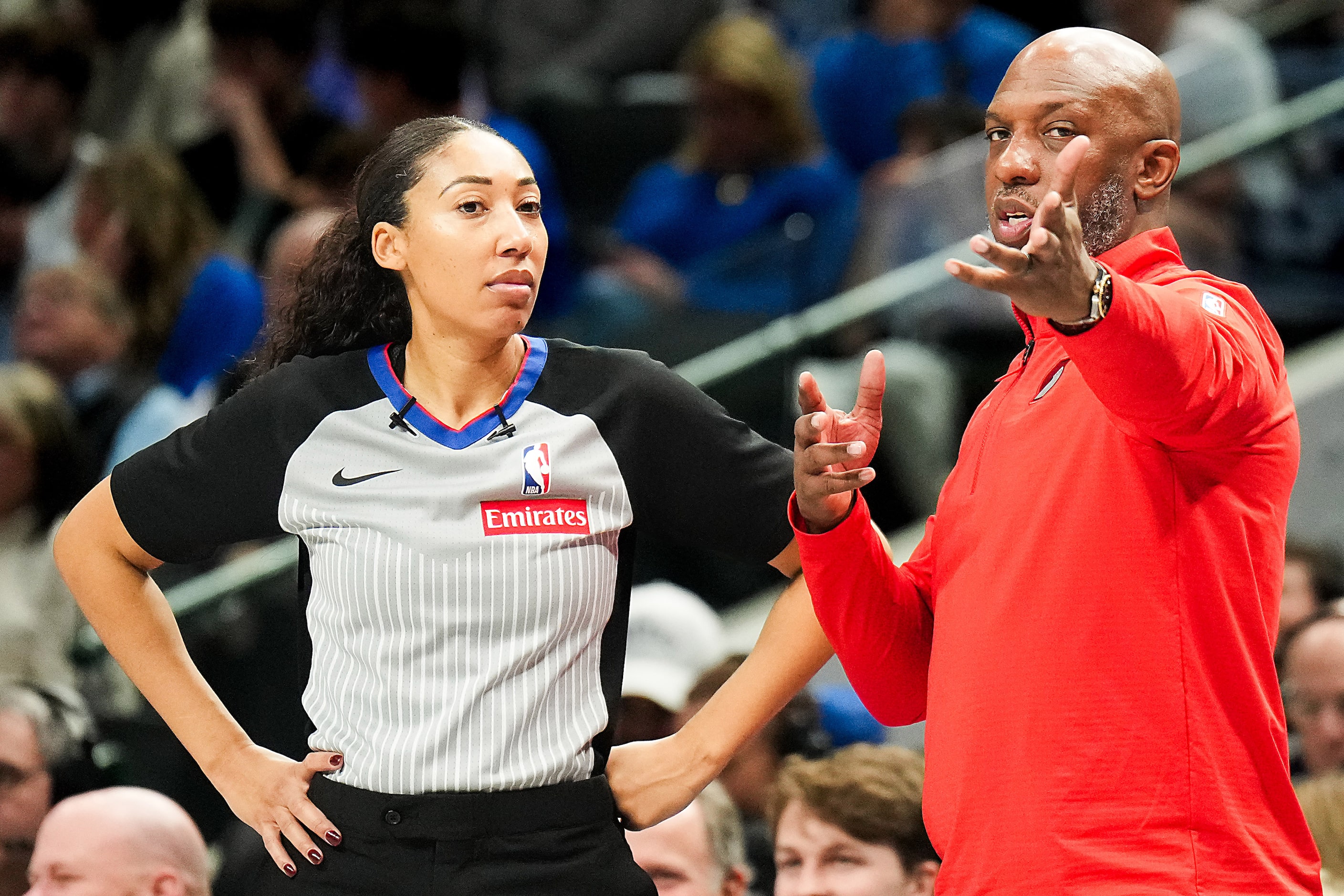 Portland Trail Blazers head coach Chauncey Billups talks with referee Simone Jelks during...