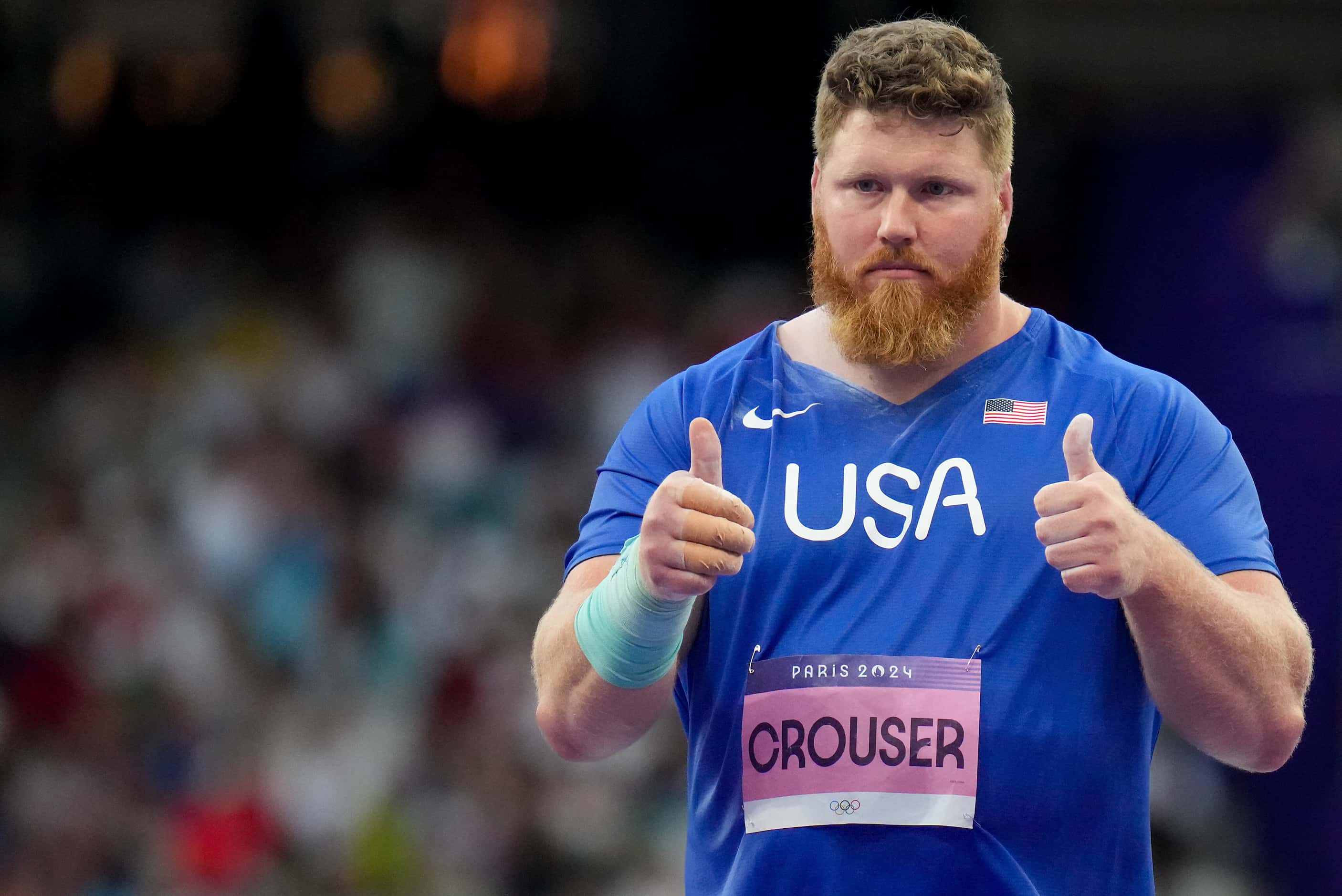 Ryan Crouser reacts while competing in shot put qualifying at the 2024 Summer Olympics on...