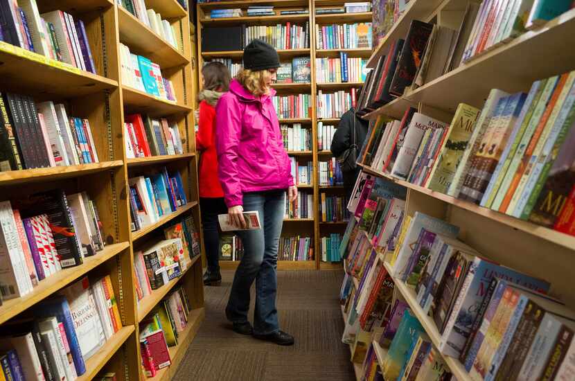 Shoppers browse among the narrow rows of books at The Book Loft of German Village in...