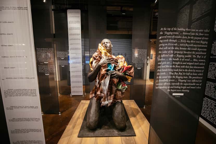 Doubt by Titus Kaphar sits amid accounts of slaves and former slaves at the Legacy Museum in...