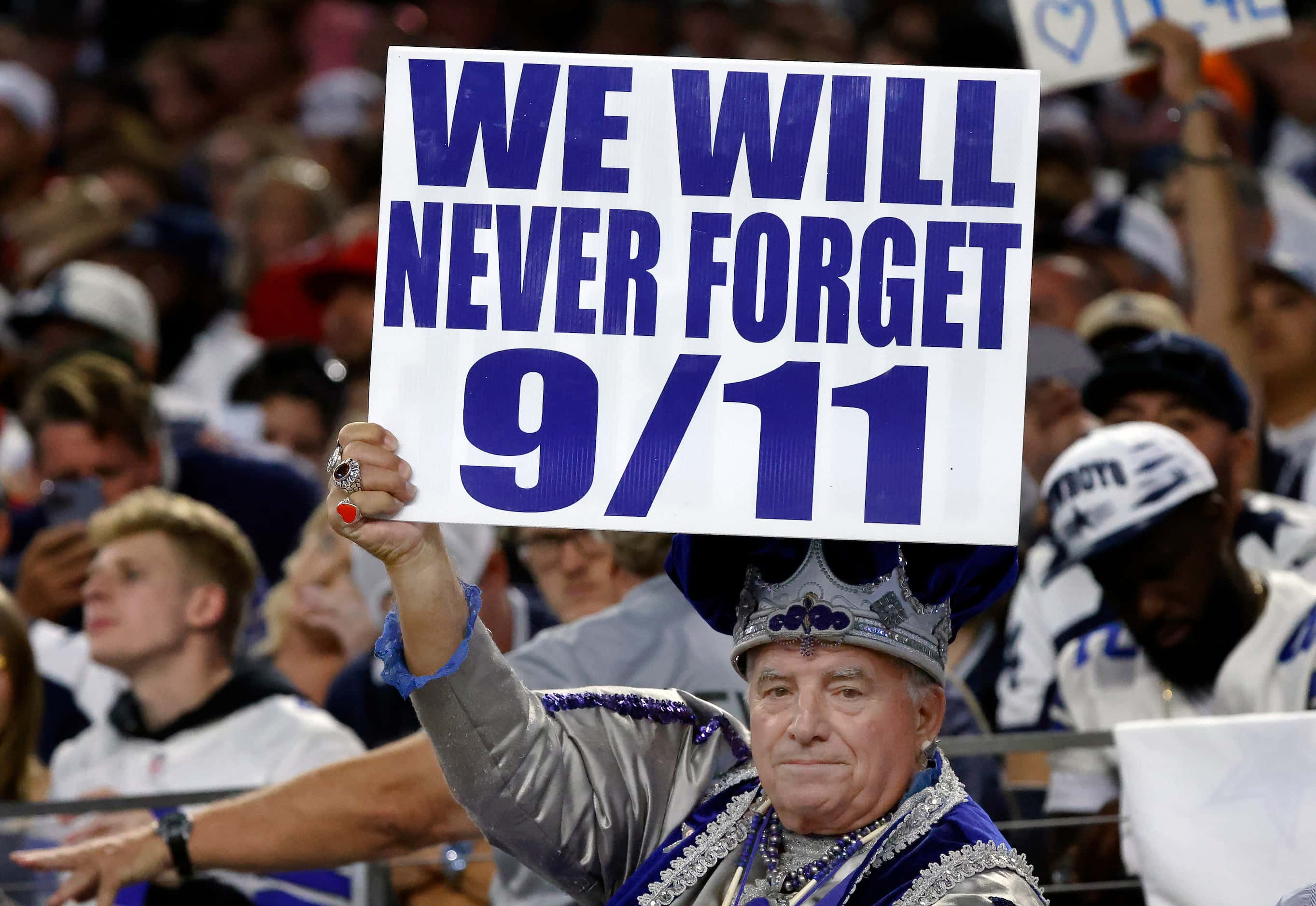 A Dallas Cowboys fan expresses his feelings on the anniversary of 9/11 during the teams...