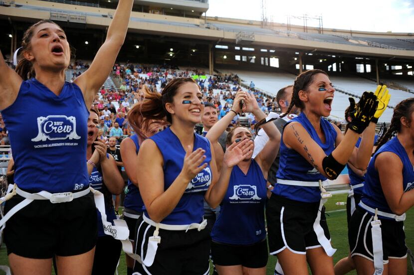 The Brunettes team celebrated a touchdown during the 2014 BvB game.
