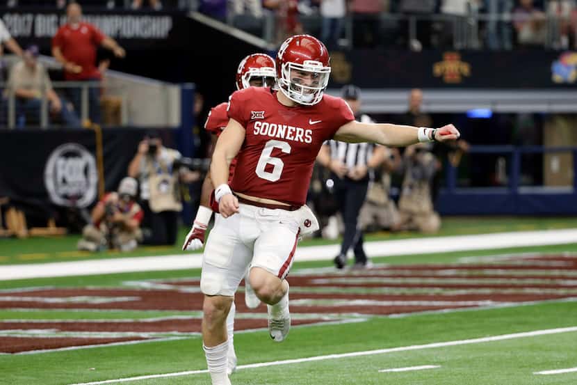 Oklahoma quarterback Baker Mayfield (6) celebrates throwing a long pass for a touchdown in...
