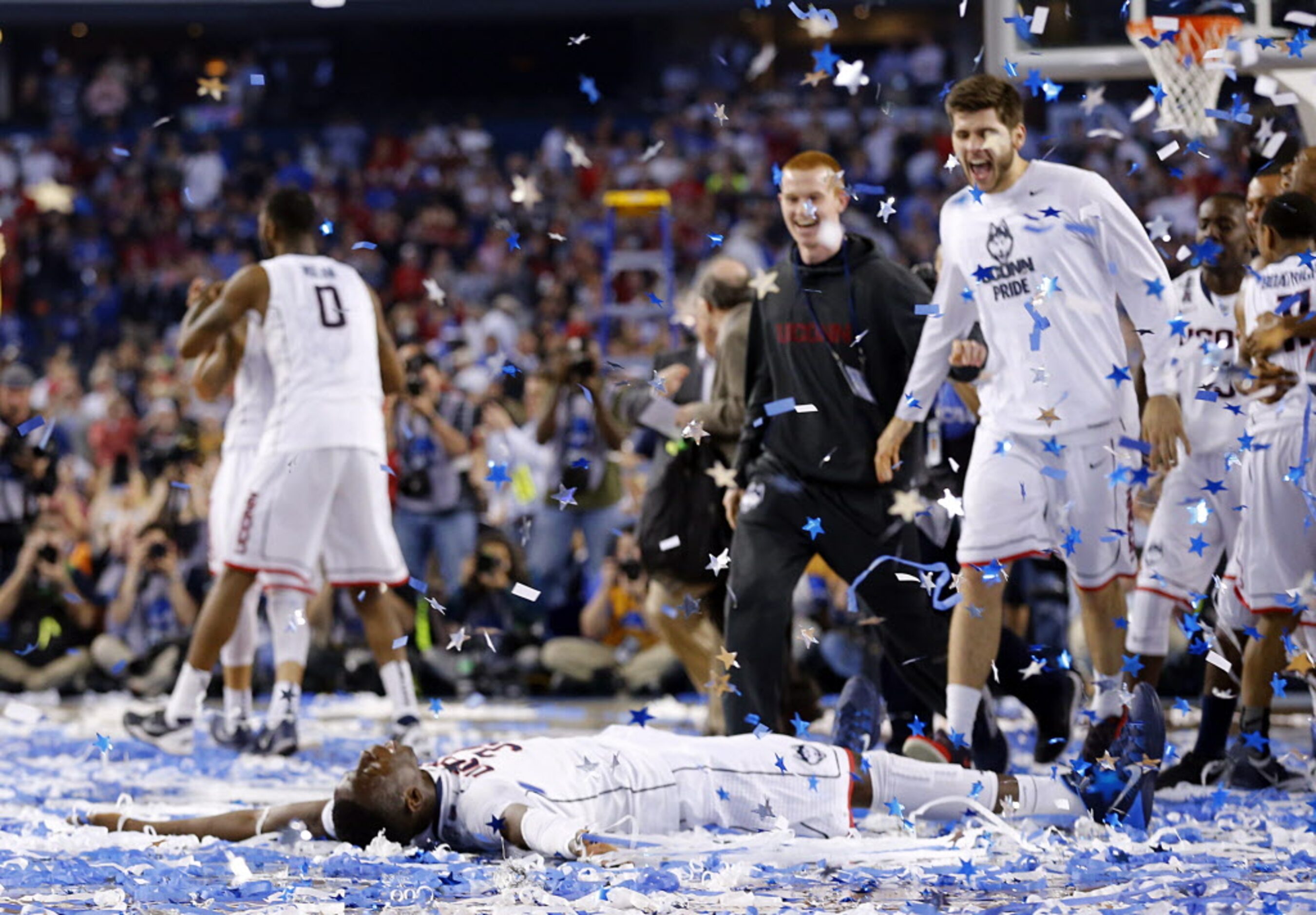 Connecticut Huskies center Amida Brimah (35) does confetti angles at center court after...