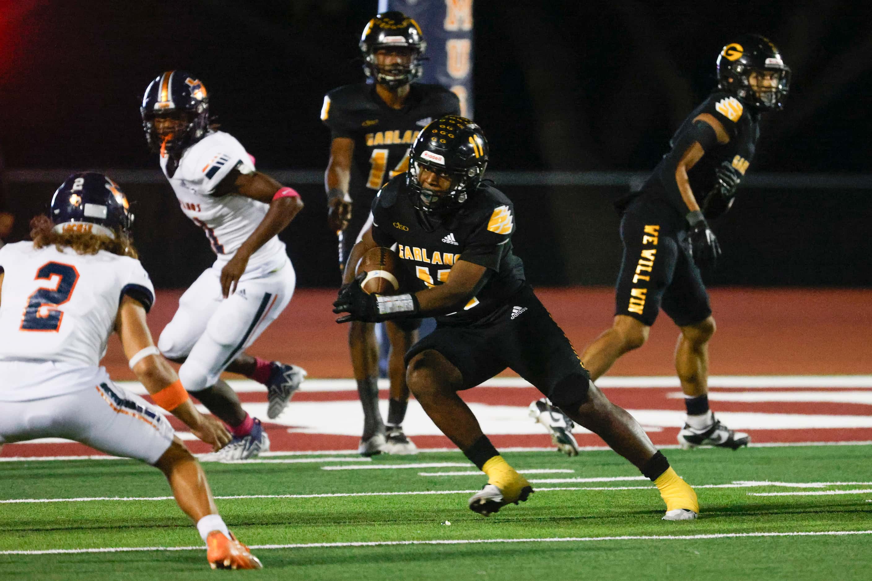 Garland High school’s De’Adrian Hardy runs with the ball during the second half of a...