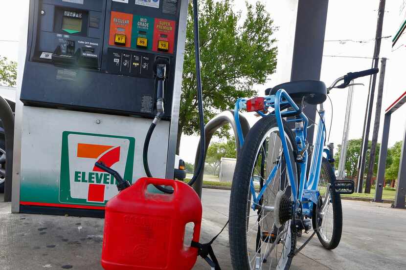 A bicycle and gas container sit at the pumps at 7-Eleven on the corner of North Zang and...