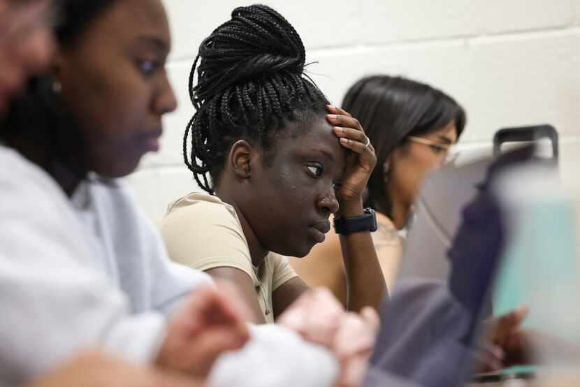 Liliana Toto rests her hand on her head while listening to a video in class on Tuesday, June...