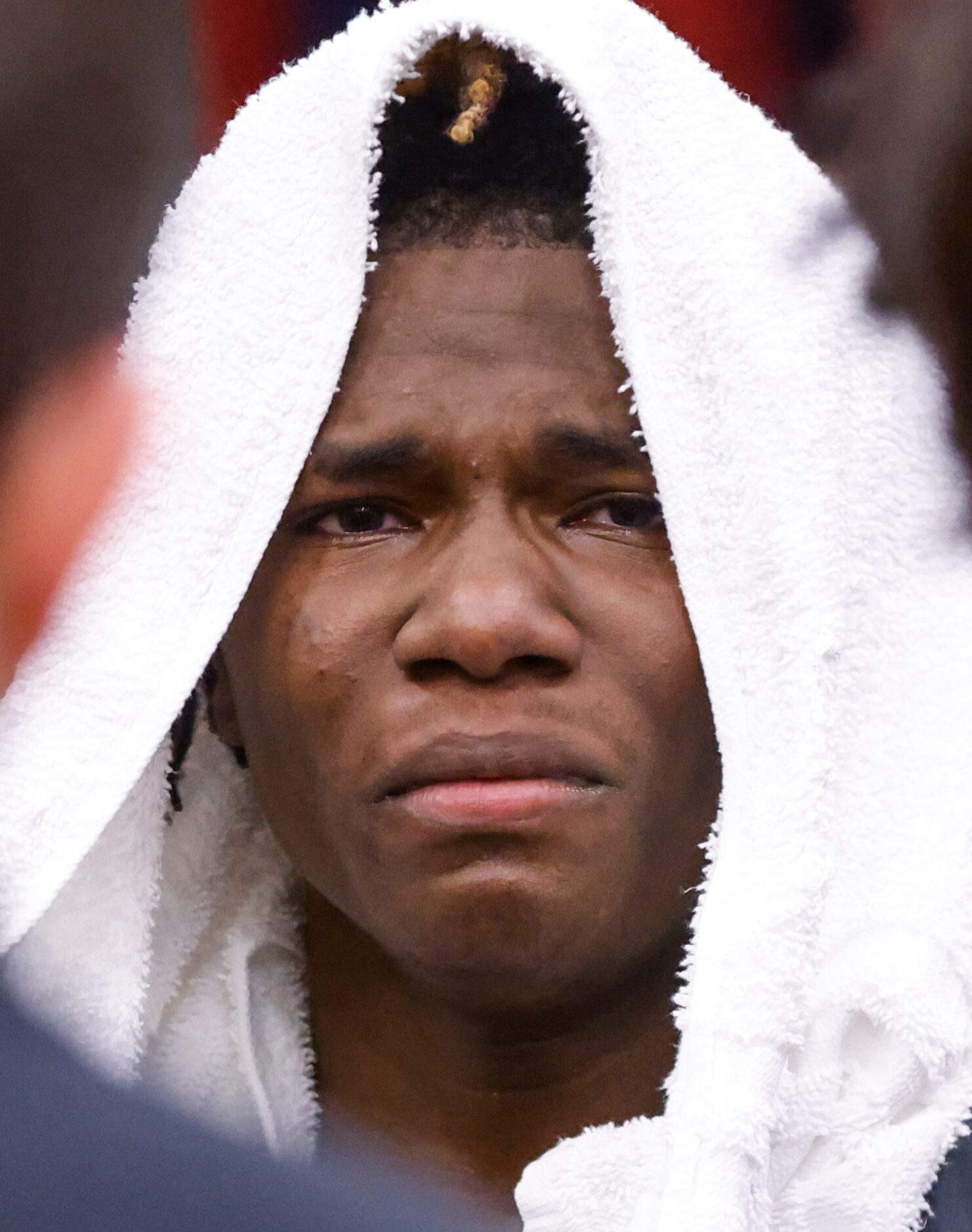 The Colony’s Jahyden Davis (0) stands dejected as The Colony’s head coach Cleve Ryan talks...