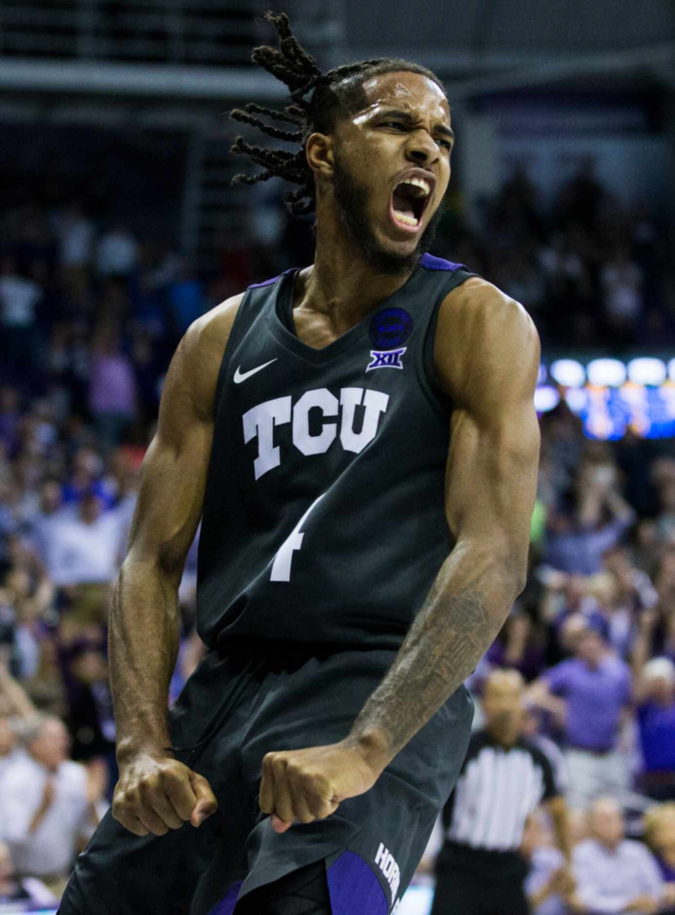 TCU Horned Frogs guard PJ Fuller (4) reacts after a dunk during the second half of an NCAA...