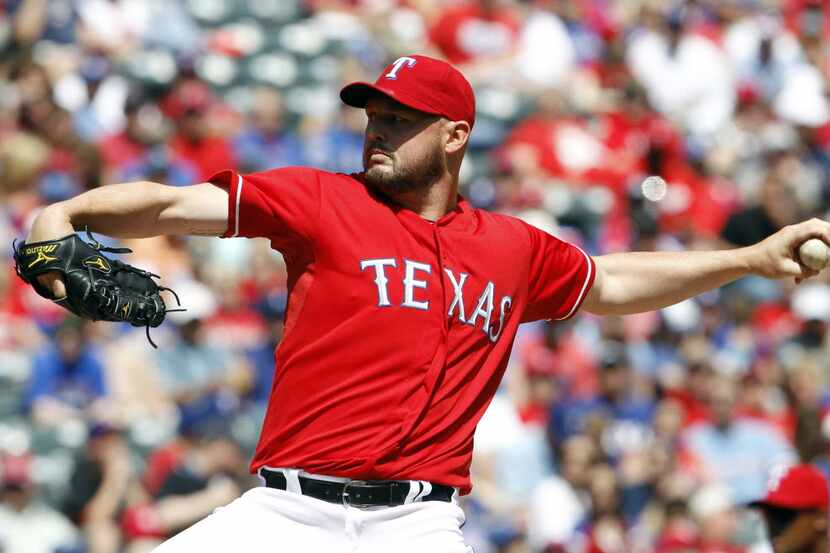 Texas Rangers starting pitcher Matt Harrison (54) pitches the ball against the Los Angeles...