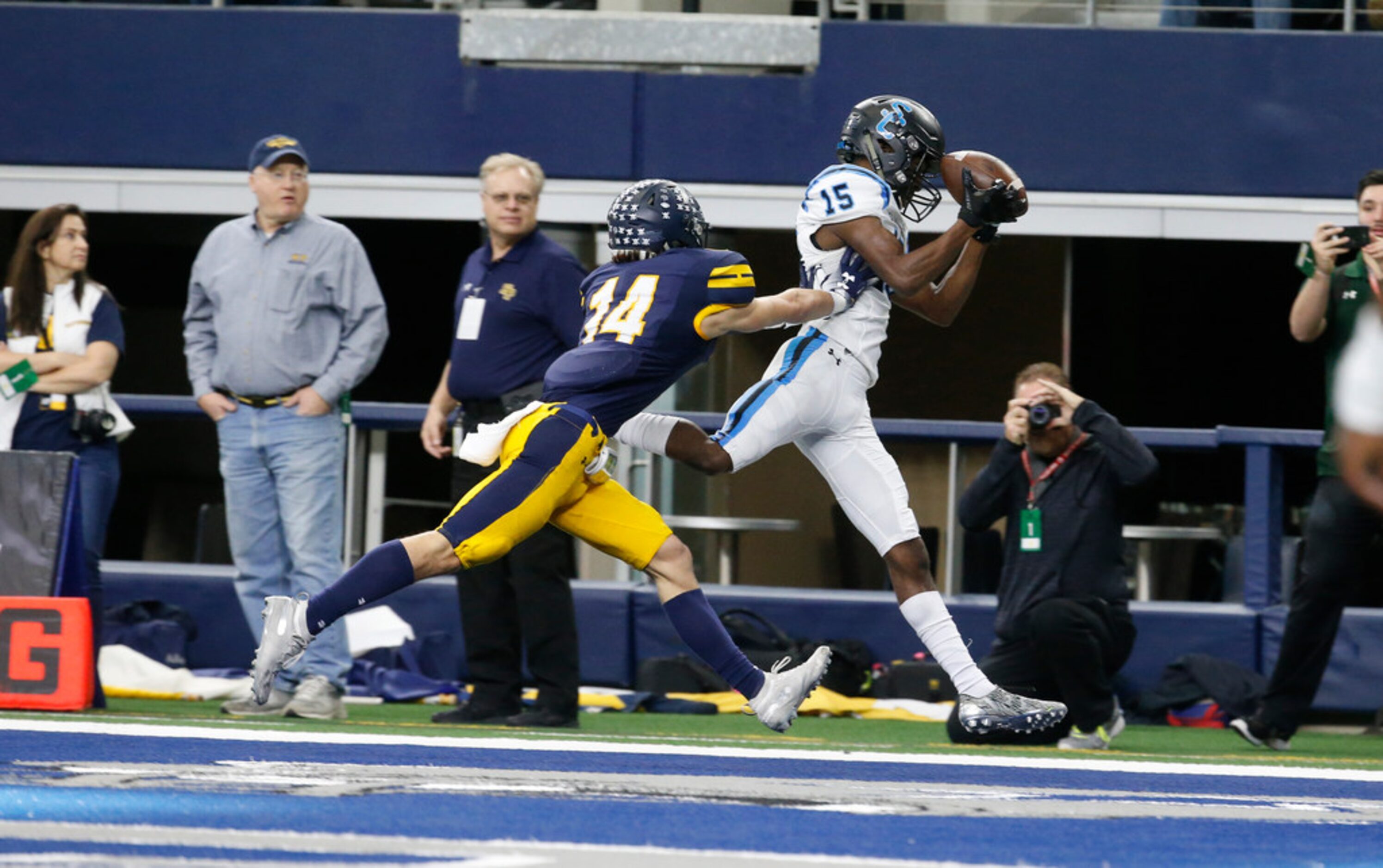 Highland Park's Hudson Clark (14) pushes Shadow Creek's Jared Jackson (15) as he catches a...