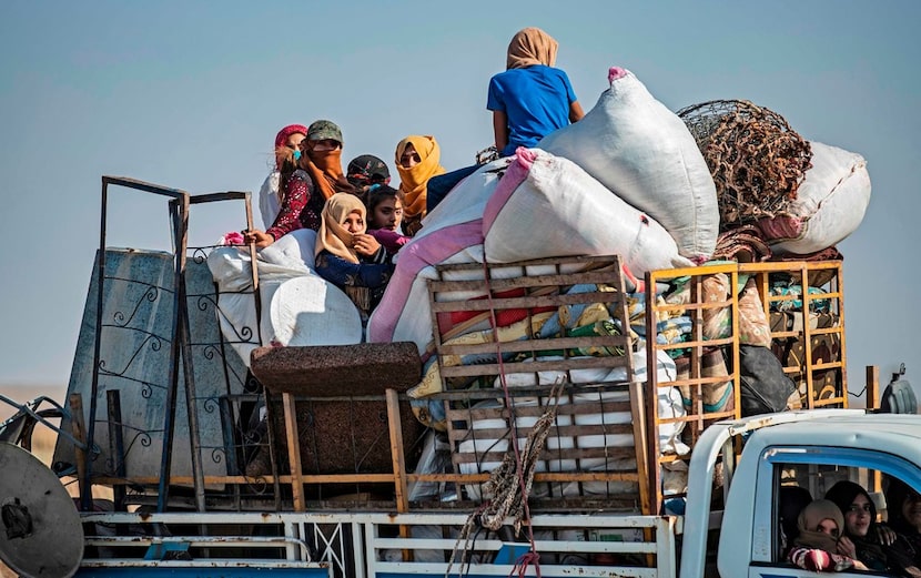 Syrian Arab and Kurdish civilians arrive in Tall Tamr town, in the Syrian northwestern...