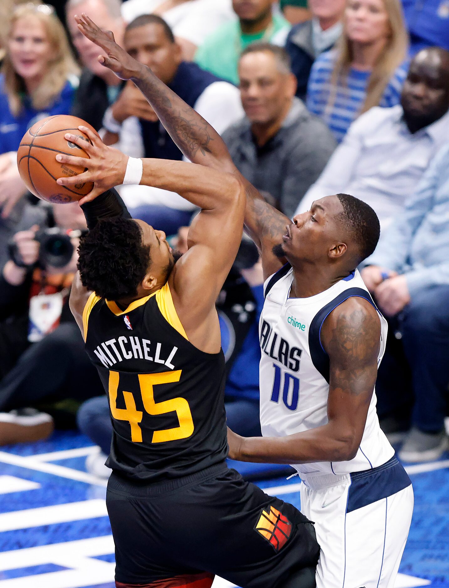 Dallas Mavericks forward Dorian Finney-Smith (10) defends Utah Jazz guard Donovan Mitchell...