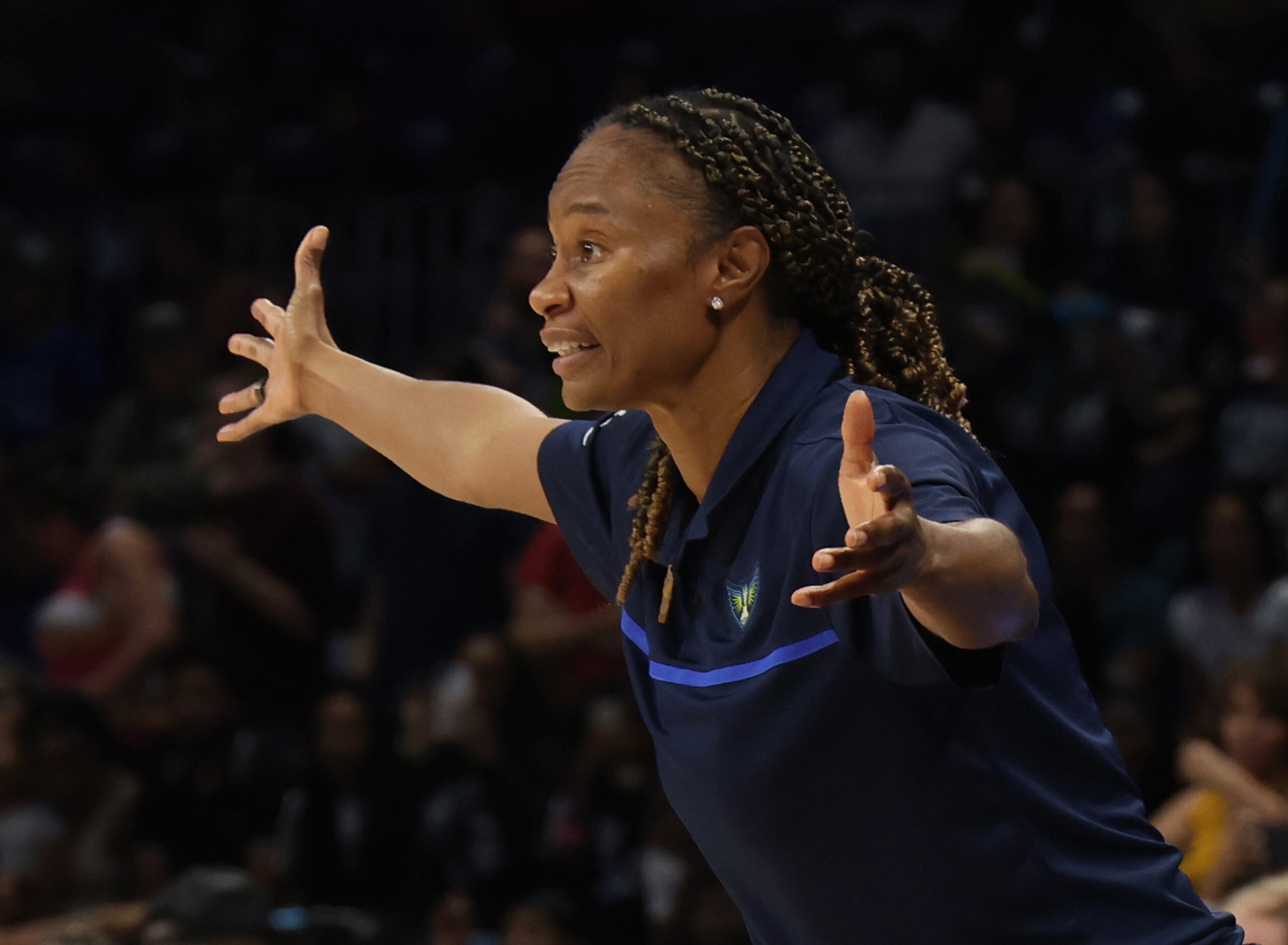 Dallas Wings head coach Vickie Johnson encourages her players during the overtime period of...