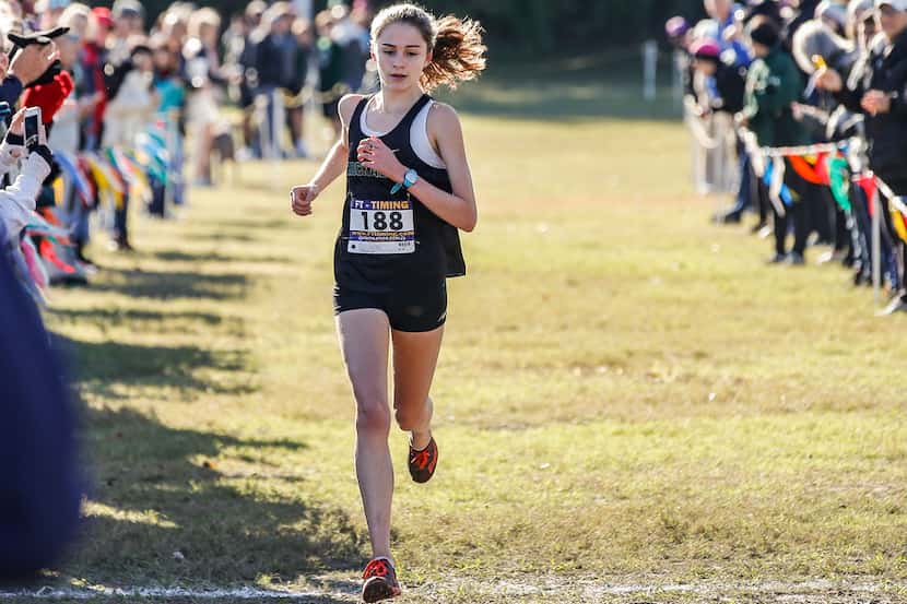 Hockaday's Adoette Vaughan crosses the finish line during the SPC cross country meet at...