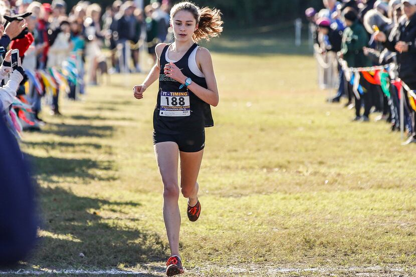 Hockaday's Adoette Vaughan crosses the finish line during the SPC cross country meet at...