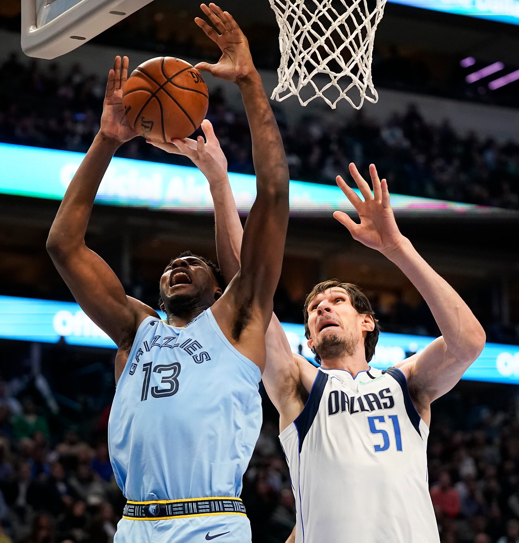 Dallas Mavericks center Boban Marjanovic (51) fights for a rebound against Memphis Grizzlies...