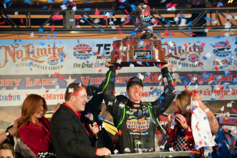 Kyle Busch (18) in the Interstate Batteries Toyota celebrates after winning the Sprint Cup...