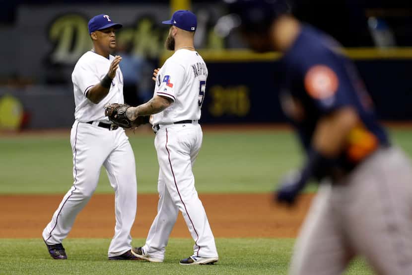 Texas Rangers third baseman Adrian Beltre, left, celebrates with first baseman Mike Napoli...