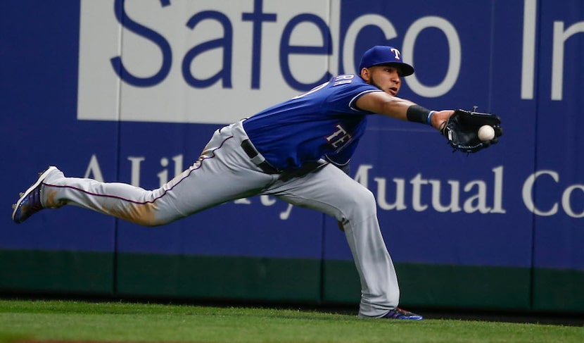 SEATTLE, WA - APRIL 12:  Right fielder Nomar Mazara #30 of the Texas Rangers makes a diving...