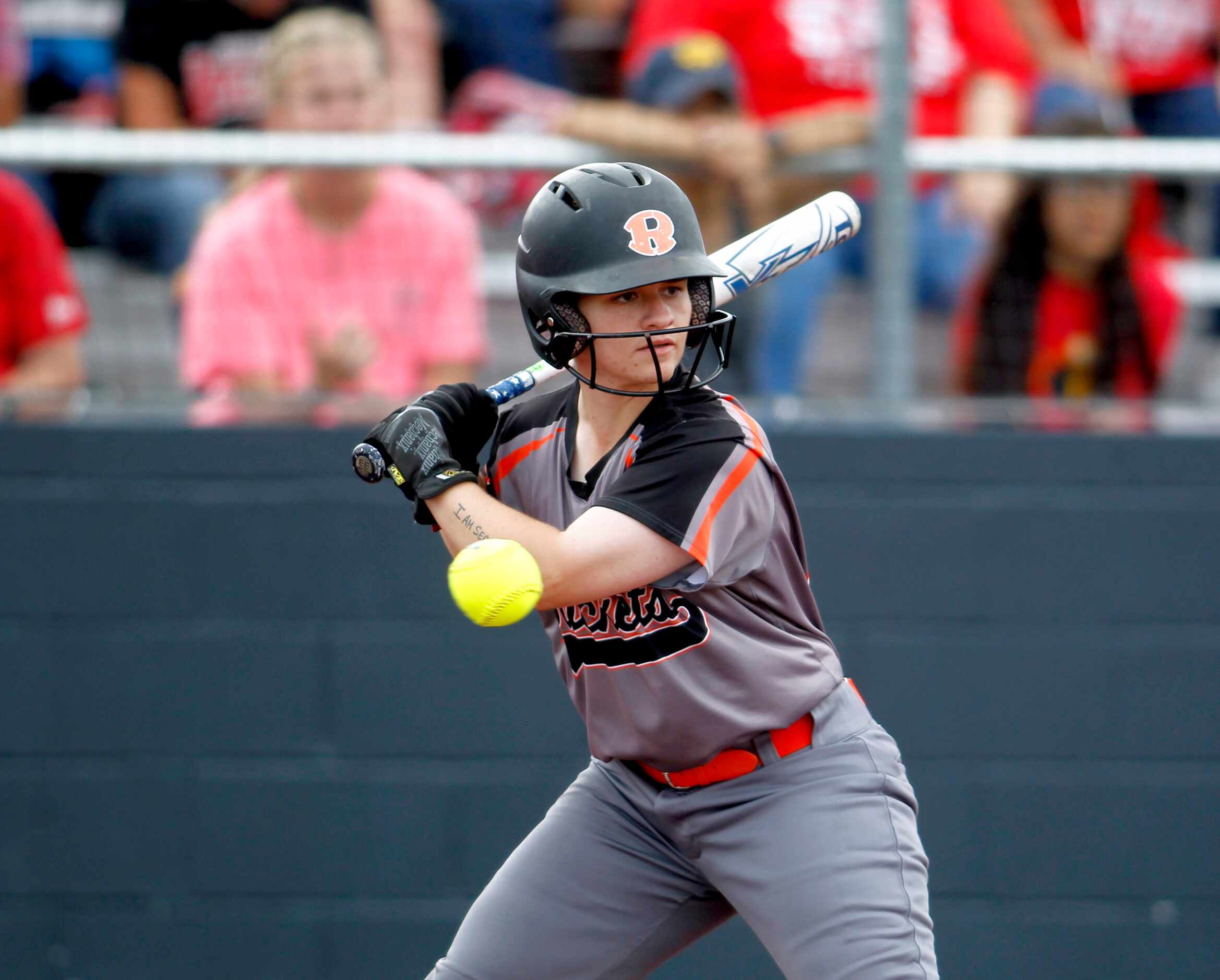 Rockwall's Ashley Monks (00) watches a pitch go by during the top of the 3rd inning against...