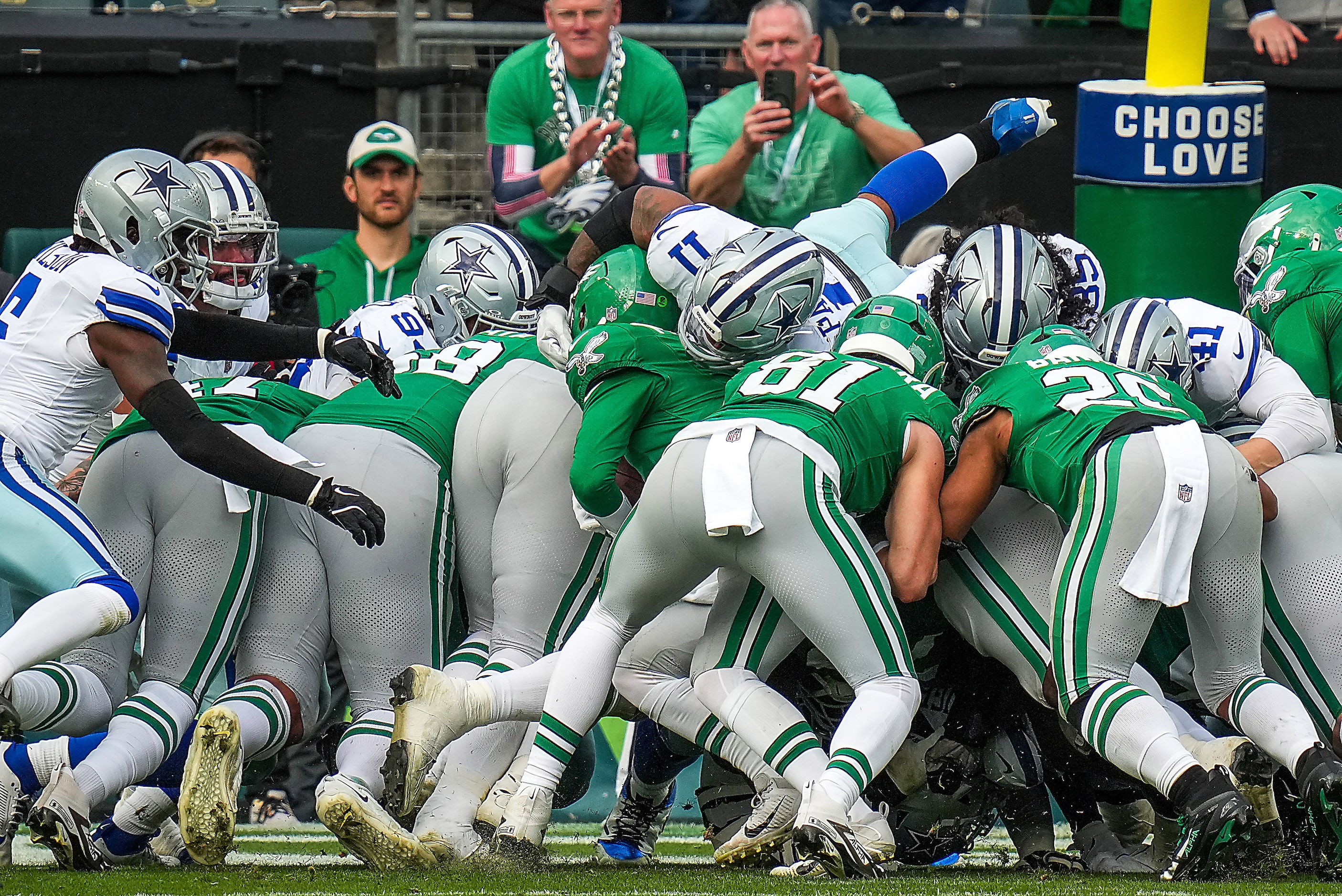 Philadelphia Eagles quarterback Kenny Pickett (7) scores on a 1-yard touchdown despite a...