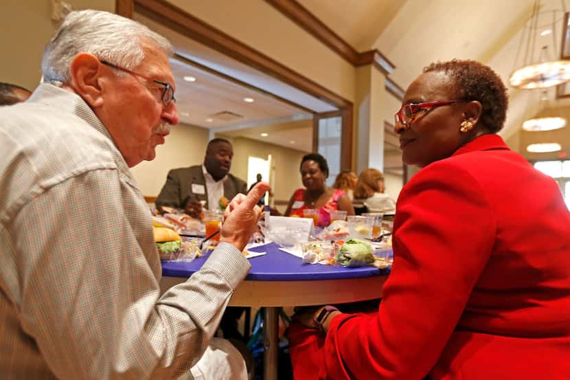 Roy Vandiver visits with Juanita Pounds at the dining table during the Together We Dine...